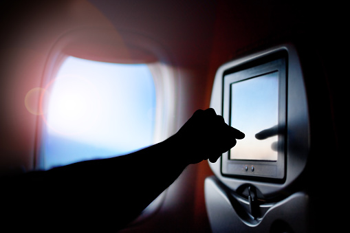 Seat passenger on the plane screen monitor. Window air travel.