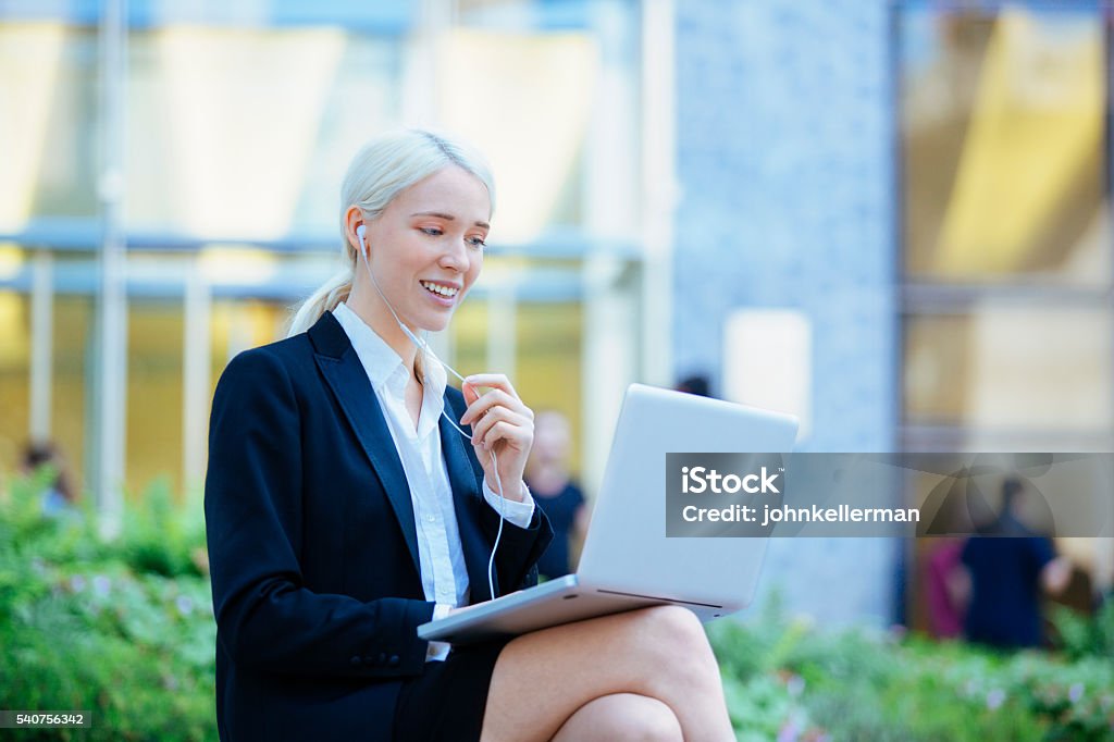 Entrepreneur with Headphones having on-line meeting Adult Stock Photo