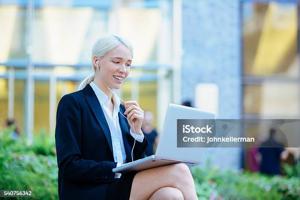 Entrepreneur With Headphones Having Online Meeting Stock Photo - Download Image Now