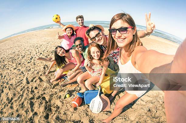 Group Of Multiracial Happy Friends Taking Fun Selfie At Beach Stock Photo - Download Image Now