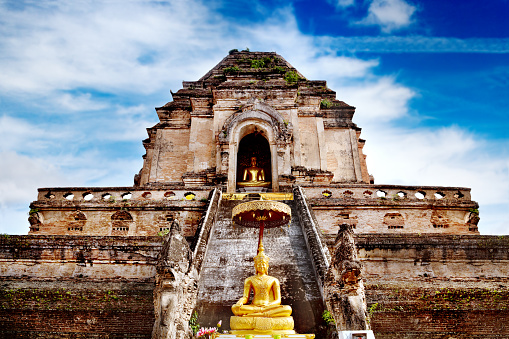 Ancient temple of Wat Chedi Luang in Chiang Mai, Thailand. Travel asia, golden buddha.