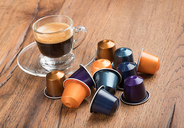 Cup of Coffee with Capsules, Nestle Nespresso Kaffeekapseln stock photo