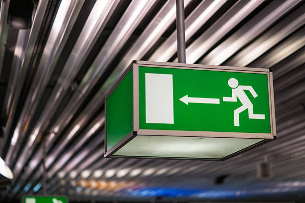 istock Emergency exit sign at an international airport 540758984
