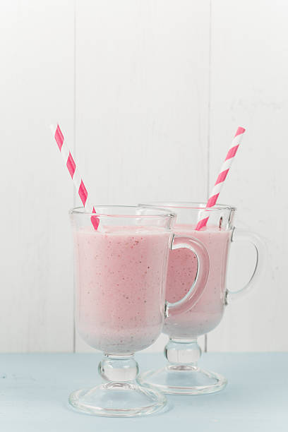 istock Two ice-cream pink cocktails with strawberries 540759666
