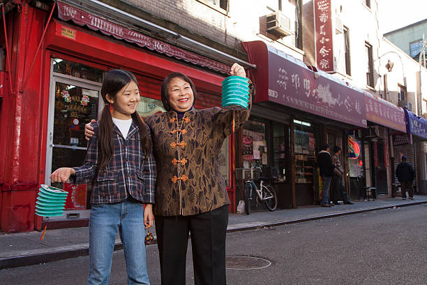 Asian family in front of store