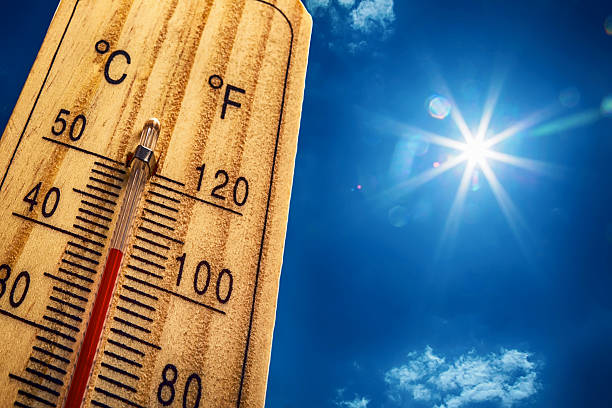 thermometer sun 40 degres. hot summer day. high summer temperatures - yanmış stok fotoğraflar ve resimler