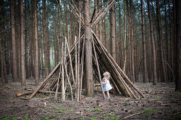 Little girl in the wood stock photo