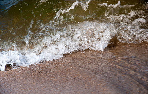 istock Wave of blue ocean on sandy beach 540824840