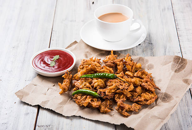istock onion bhaji or pakora served with tomato ketchup and tea 540825882