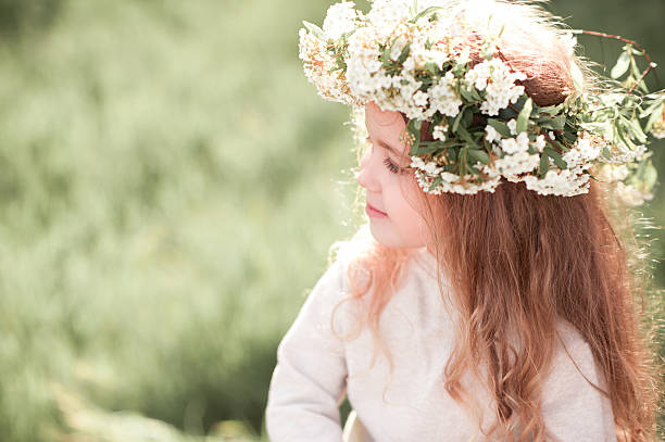 istock Girl with floral wreath 540826580