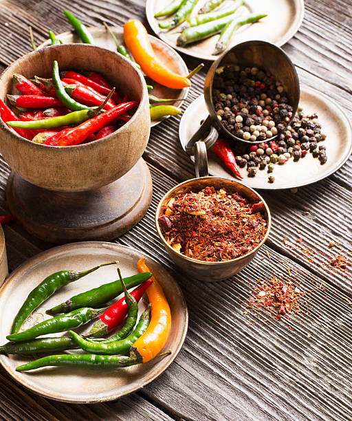 istock Hot peppers and spices on a dark wooden background 540826694