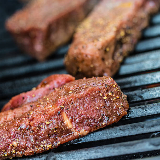 istock Raw sirloin steaks on the bbq 540828174
