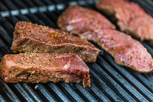 istock Raw sirloin steaks on the bbq 540828318