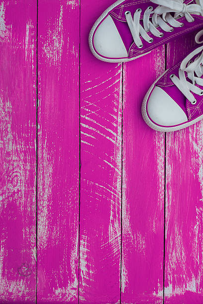 istock Vertical background with sneakers color purple 540829162