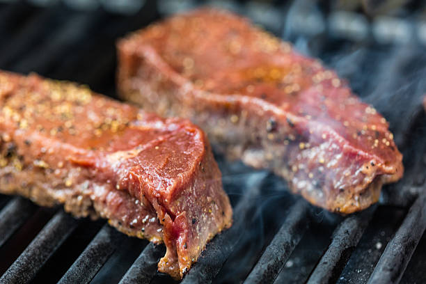 istock Raw sirloin steaks on the bbq 540830232