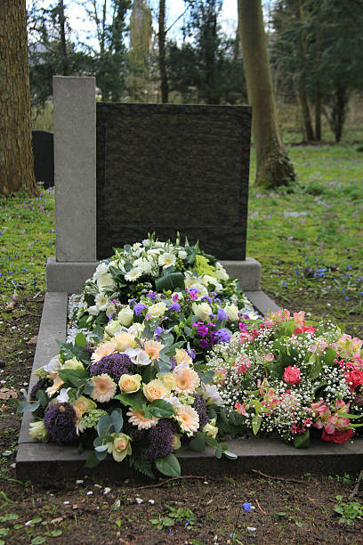 istock Sympathy flowers on a grave 540830380