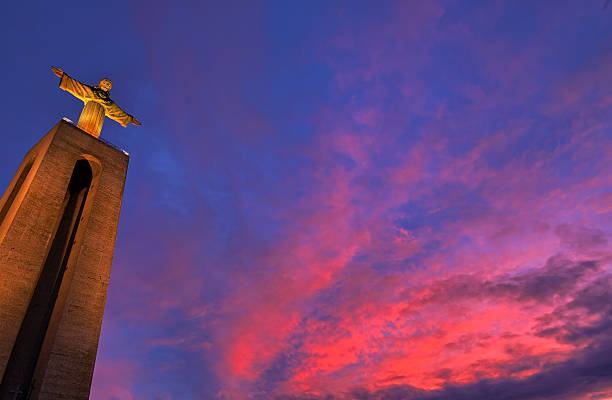 Statue of Christ the King in Lisbon at sunset stock photo