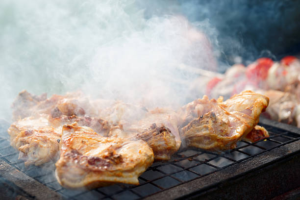 istock Chicken legs being fried on grill 540830804