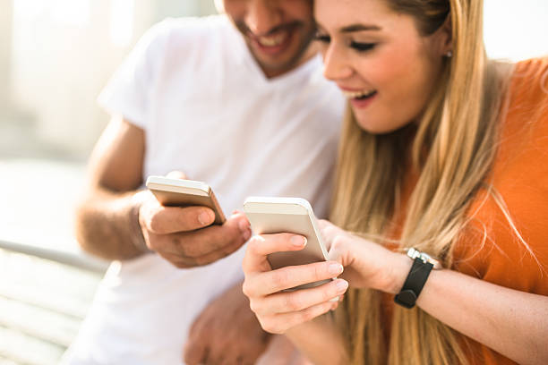 istock couple text messaging on the phone in Dubai Marina 540830974