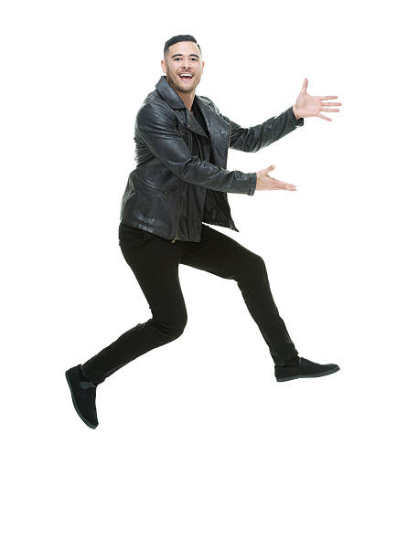 tersenyum santai pria melompat dan menyajikan - jaket kulit foto potret stok, foto, & gambar bebas royalti