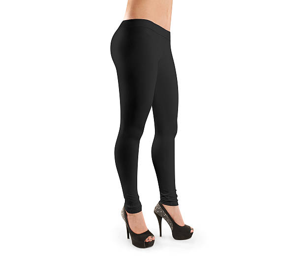 Woman wear black blank leggings mockup, isolated, clipping path Woman wear black blank leggings mockup, isolated, clipping path. Women in clear leggins template. Cloth pants design presentation. Sport pantaloons stretch tights model wearing. Slim legs in apparel. see through leggings stock pictures, royalty-free photos & images