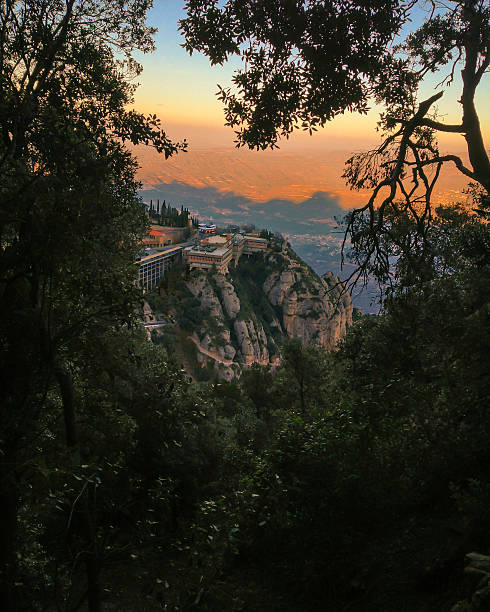 istock Tree-framed view of Montserrat Monastery, Spain 540833230