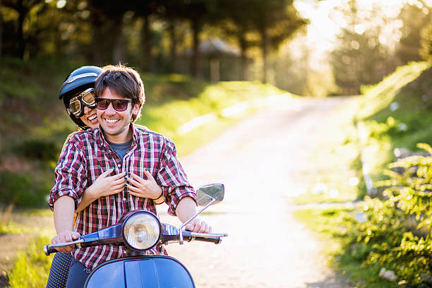 istock Happy couple on a scooter at summer vacation 540833616