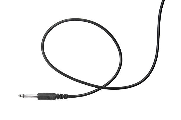 istock Guitar audio jack with black cable isolated on white background 540833872