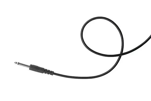 Photo of Guitar audio jack with black cable isolated on white background