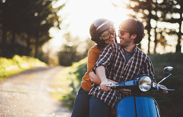 istock Happy young couple riding vintage motorcycle 540835422