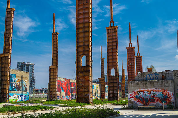 Turin, Piedmont, Italy -  March 29, 2014: Steel pillars and walls covered with graffiti featuring the Parco Dora, a public park built on the post-industrial areas once occupied by the big factories.