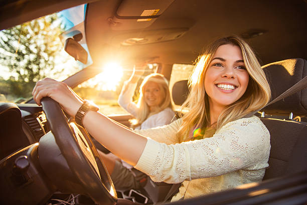 Going on a family vacation Daughter and mother going on a family vacation. driving stock pictures, royalty-free photos & images