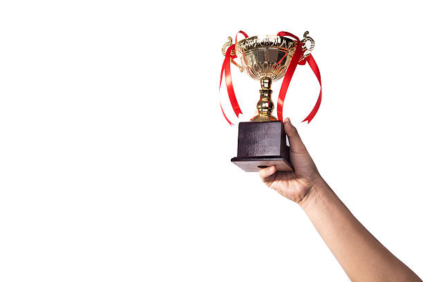 istock Athlete lifting up gold trophy with one hand 540836976