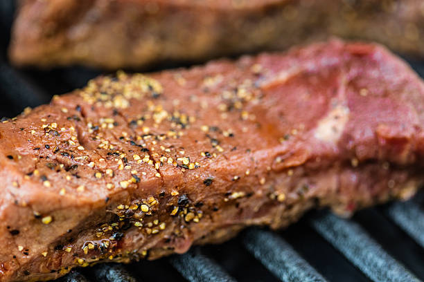 istock Raw sirloin steaks on the bbq 540837702