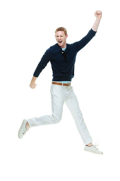 istock Excited casual man cheering and jumping 540839620