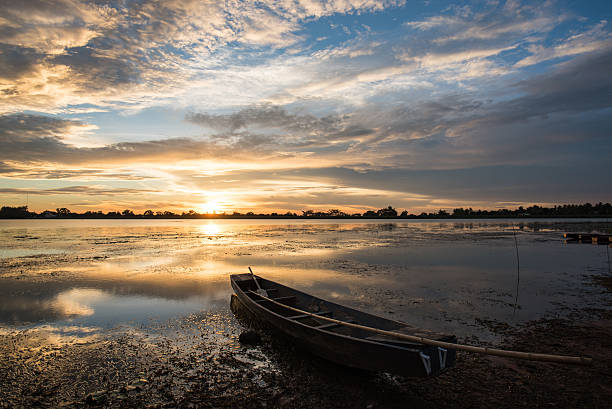 istock small fishing boat in Sunset. 540840510