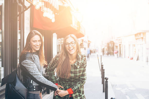 istock Smiling young women holding hands and having fun 540840842