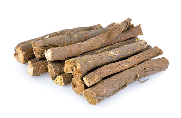 istock Liquorice roots isolated on white background 540841158