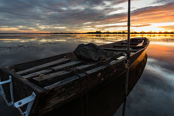 istock Small fishing boat in sunset. 540841722