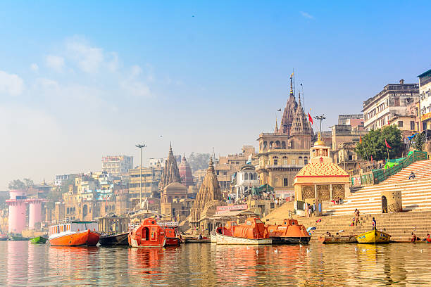 morning view at holy ghats of varanasi, india - morning river ganges river varanasi imagens e fotografias de stock