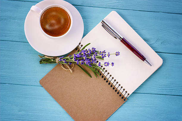 istock blank white notebook, bunch of lavender and cup of coffee 540842290