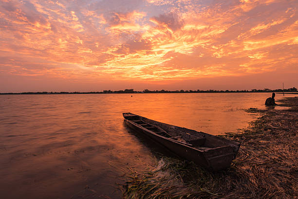 istock Small fishing boat in sunset. 540844084