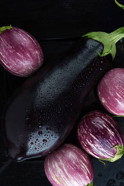 istock wet eggplants top view extreme closeup 540844416