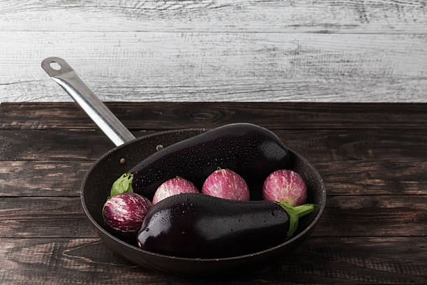 istock Wet eggplants in frying pan with copy space 540844448