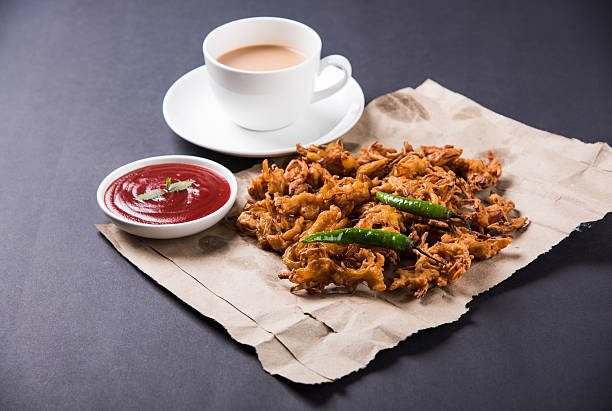istock onion bhaji or pakora served with tomato ketchup and tea 540844478