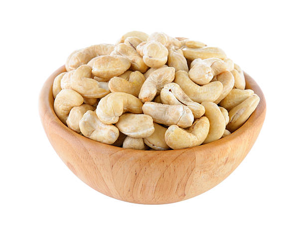 istock cashew nut in wood bowl on white background 540844632