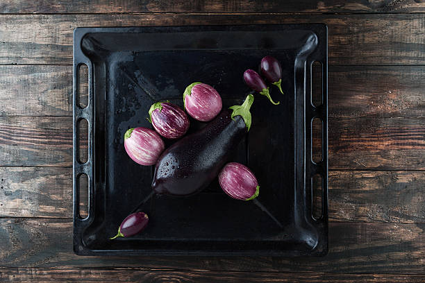 istock wet eggplants in frying pan top view 540844646