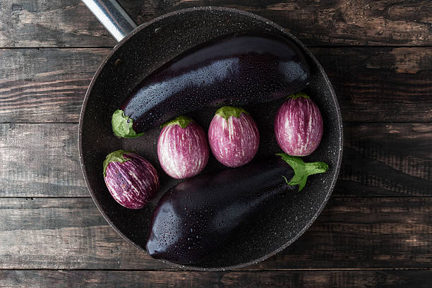 istock Eggplants sprinkled with water in frying pan 540845250