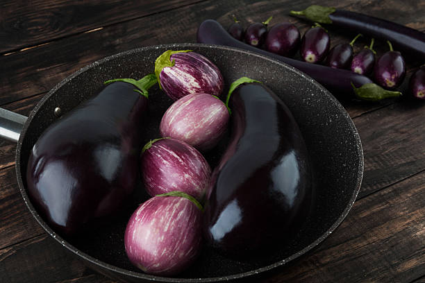 istock Eggplant varieties on wooden table 540845328
