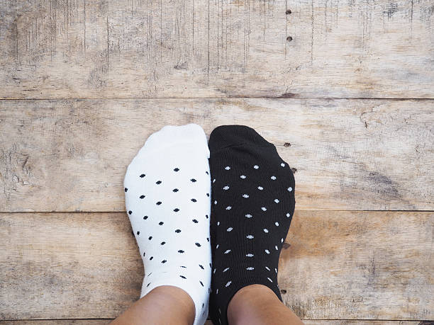 istock feet wearing black and white polka dot socks 540845854